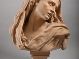 a statue of a woman with a veil on her head