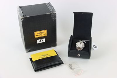 an image of a watch in a black box with a yellow tag