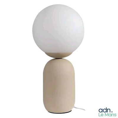 the lamp is on a wooden base and has a white ball on top of it