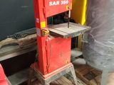 a red machine that is sitting on a pallet