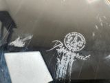 a chalk drawing on the side of a car window