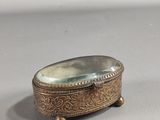 an antique silver plated box with a mirror in the middle of it
