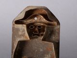 sculpture of a man with a hat and a hat on his head
