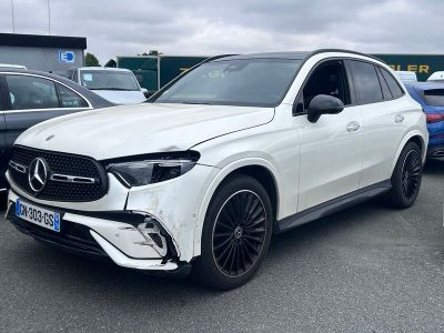 the mercedes gle is parked in a parking lot with other cars