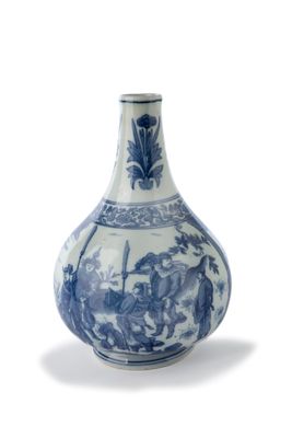 un vase bleu et blanc sur lequel est représenté un homme à cheval