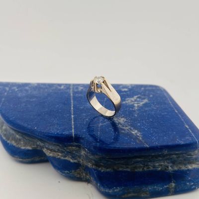 silver ring on a blue stone on a white background