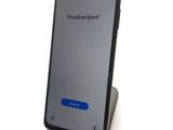 the back of an iphone with a blue button on the screen