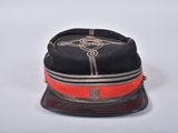 an image of a black hat with a red band and a cross on it