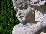 a statue of a man holding a bird in his hands