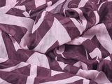 a close up of a purple and white chevroned scarf