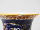 a blue vase with a picture of a tiger on it