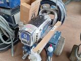 a machine that is sitting on a cart in a garage