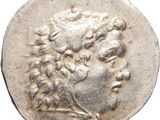 a silver coin with an image of a man ' s head on it