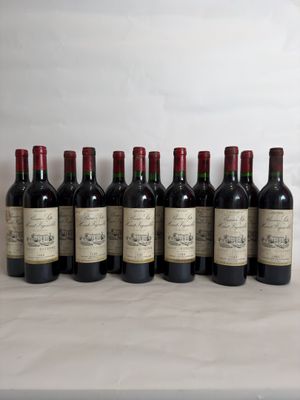 six bottles of wine are lined up on a table