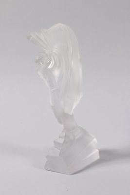 statue of a woman with a veil on her head on a white surface
