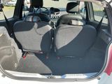 two seats in the back of a small car