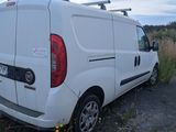 a white van that is parked on the side of the road