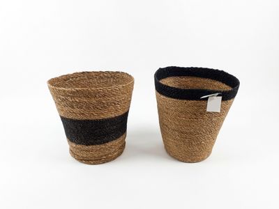 two woven baskets with black and white stripes on them