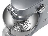 a silver mixer with a metal bowl on top of it