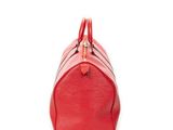a red louis vuitton speedy bag on a white background