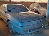 a silver car that is parked in a garage