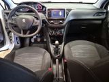 the interior of a small car with a steering wheel and dashboard