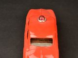 a toy car that is sitting on a black surface