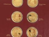 a red display case with a number of gold coins in it