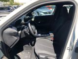the interior of a car with the door open and the driver ' s seat down