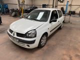 a small white car parked in a garage