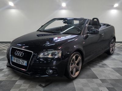 an image of a black audi convertible parked in a showroom