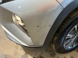 a close up of a car ' s headlight and front bumper