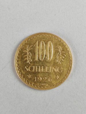 une image représentant une pièce d'or sur laquelle est posé le chiffre 100