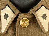 a close up of a uniform with a star on the collar