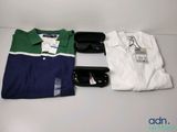 three men ' s polo shirts and sunglasses are laid out on a table