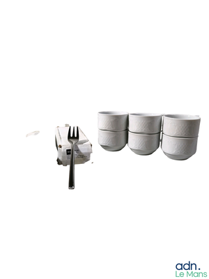 four cups and a fork sitting next to each other