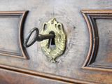 a close up of a door with a key in it