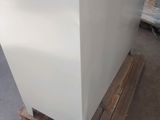 a picture of a white refrigerator sitting on top of a pallet