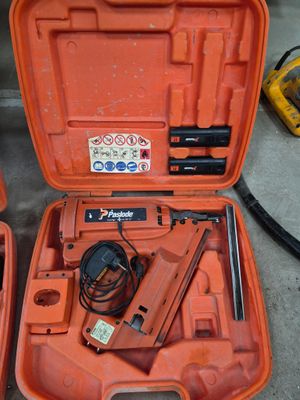two orange tools in a case on the floor
