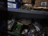 a shelf full of assorted items in a dark room