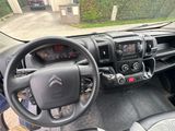 a picture of a car dashboard with a steering wheel and dashboard controls