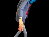 a figurine of an old man in a suit and tie