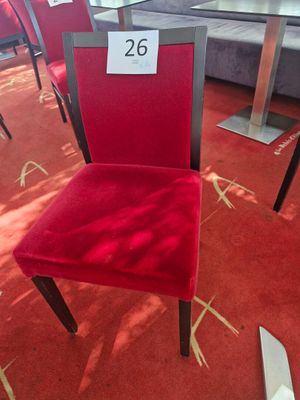 a red chair with a price tag on the back of it