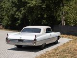 a white car that is parked on the side of the road