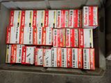 many boxes of cigarettes in a box on the floor