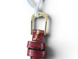 leather watch strap with a gold clasp on a white background