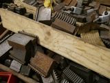 a man that is working on a piece of wood