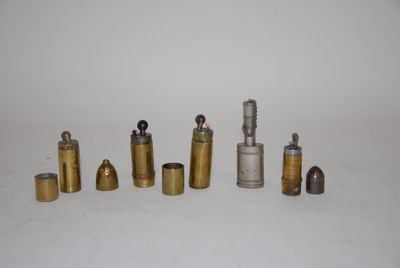 many different types of brass pipes on a white surface