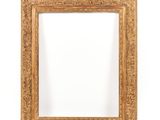 a gold frame with a white background and a white wall