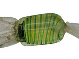 a green and white striped candy on a white background